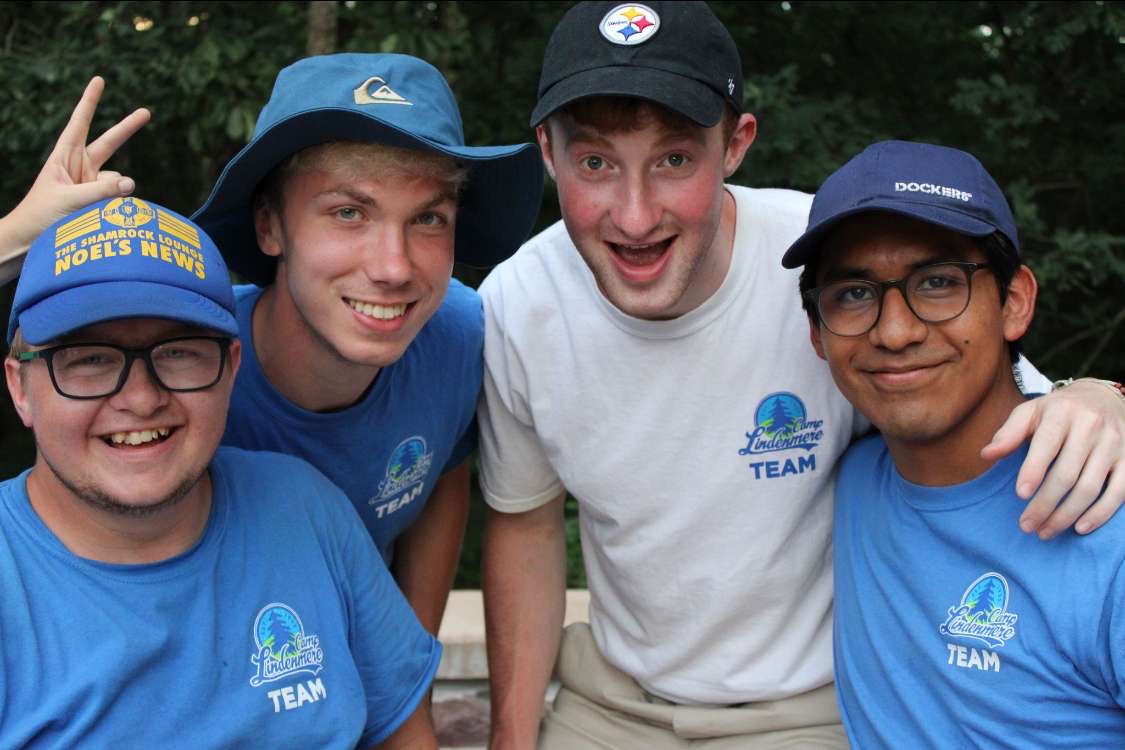 Camp Lindenmere team outdoors in matching staff shirts